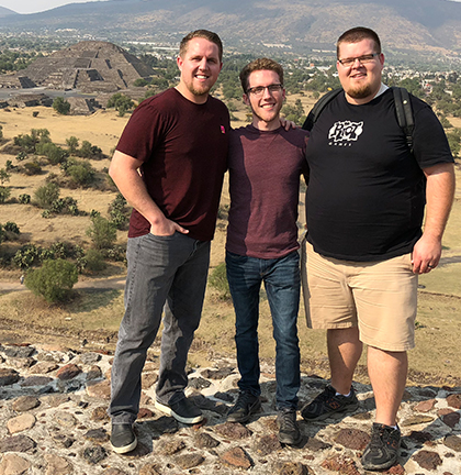 three guys standing on pyramid at teotihuacan, mexico